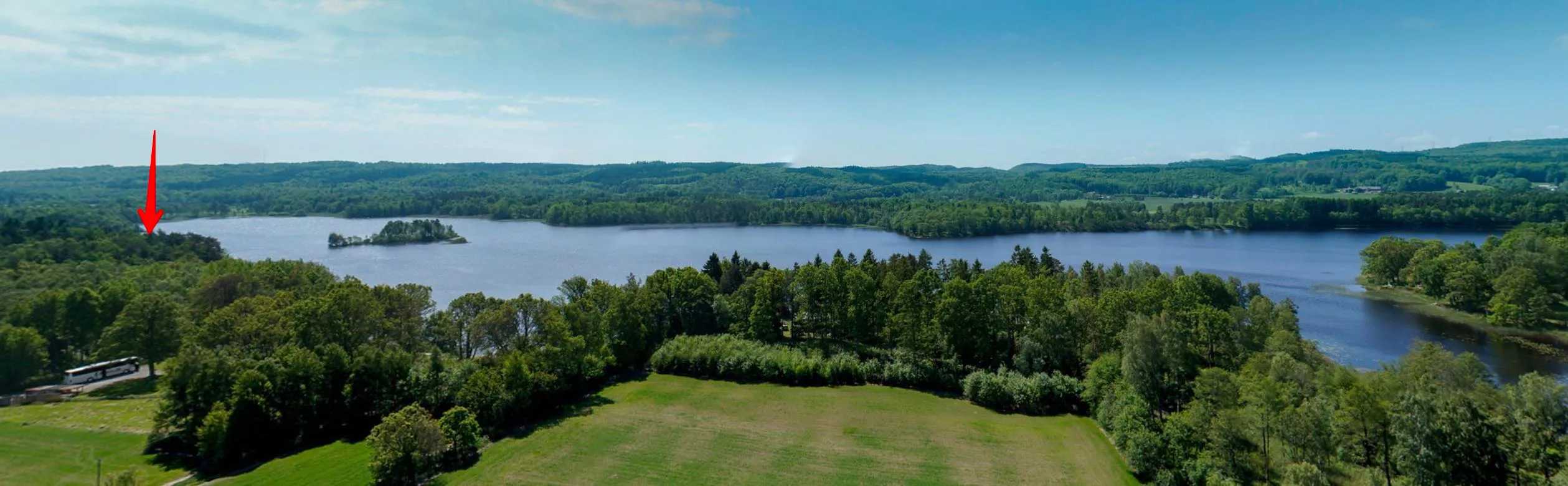 The arrow marks the house on the lake.